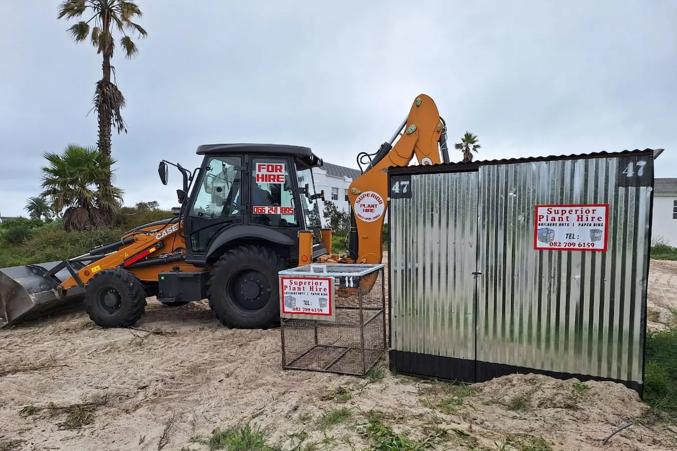 Superior Plant Hire paper bin and builders hut on site