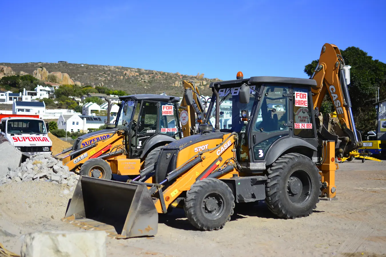Two Superior Plant Hire digger loaders parked side by side