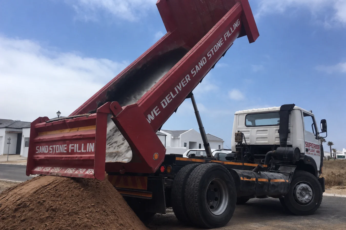 Superior Plant Hire 6 cube truck tipping a sand delivery